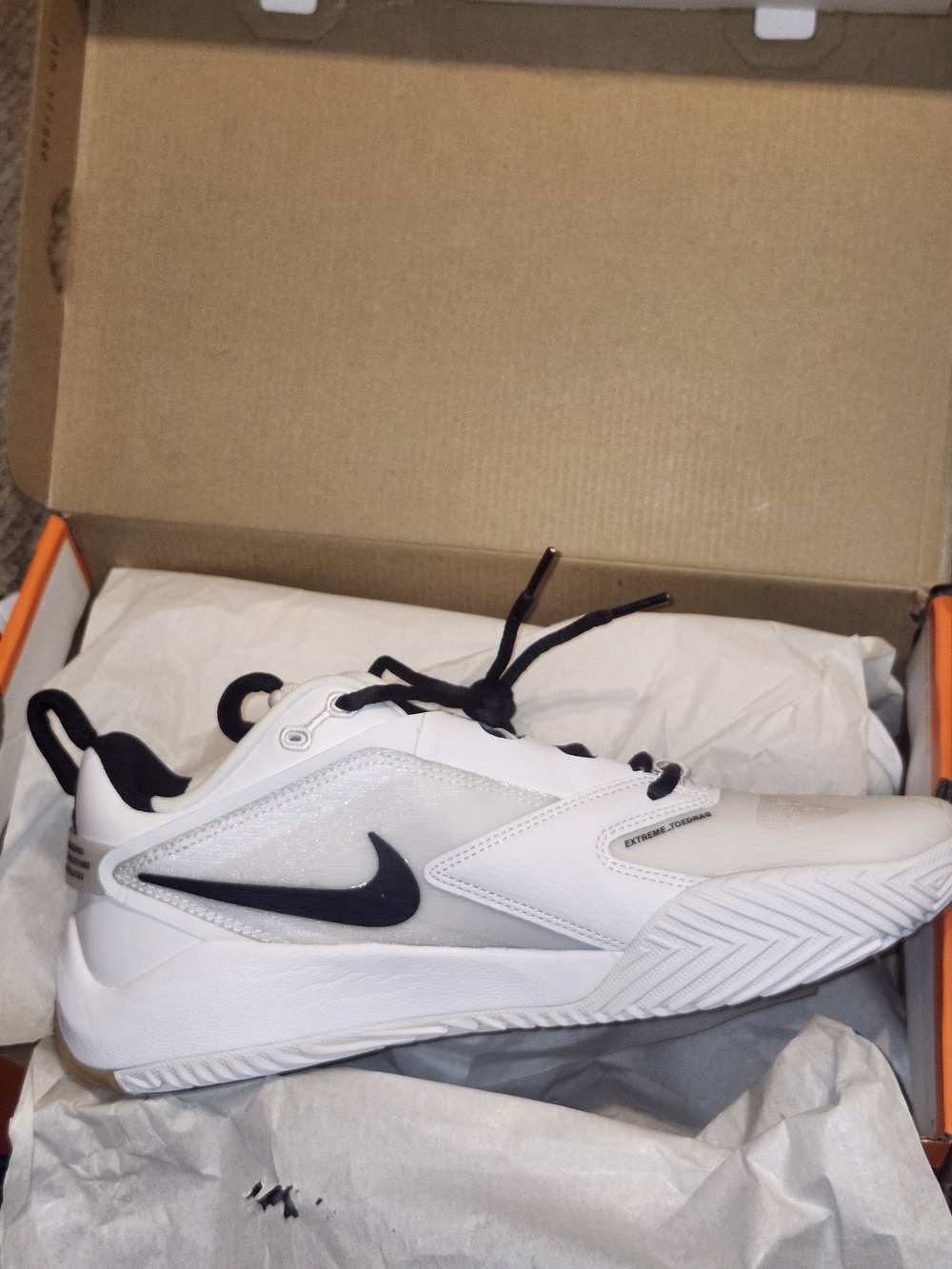 Nike White and Black Athletic Sneakers with Swoosh Accent